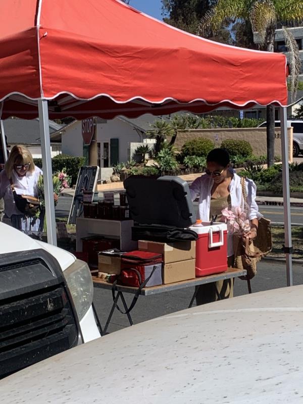 Meghan Markle takes her dog to the Farmer's Market in Montecito.