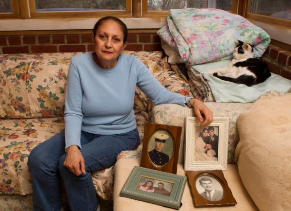 Adelaide Laurie with portraits of her husband.
