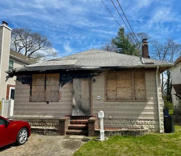 Despite heavy fire damage, the outer structure remains intact, making it appealing to buyers in a market with limited inventory. 