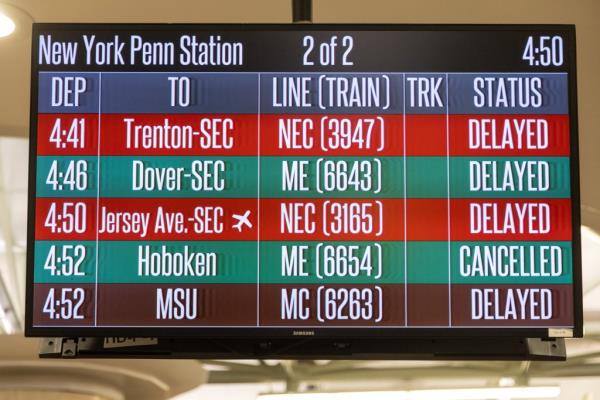 A board showing delays and cancellations. 