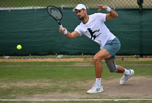 Novak Djokovic from Serbia holding a tennis racket during a training session at the Wimbledon Champio<em></em>nships 2024