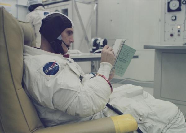 Mattingly makes final notes in his flight checklist while undergoing spacesuit pressure checks prior to participating in a countdown demo<em></em>nstration test at Kennedy Space Center in Florida, United States in preparation for the upcoming lunar landing mission in March 1972.