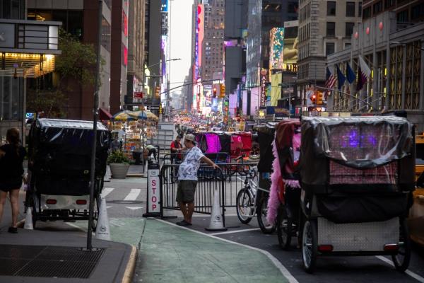 A pedicab driver looking for tourists to pick up in front of the Sheraton New York Times Square Hotel on Aug. 15, 2024.