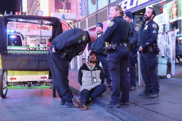 A pedicab driver getting arrested for a DWI on Oct. 30, 2022.