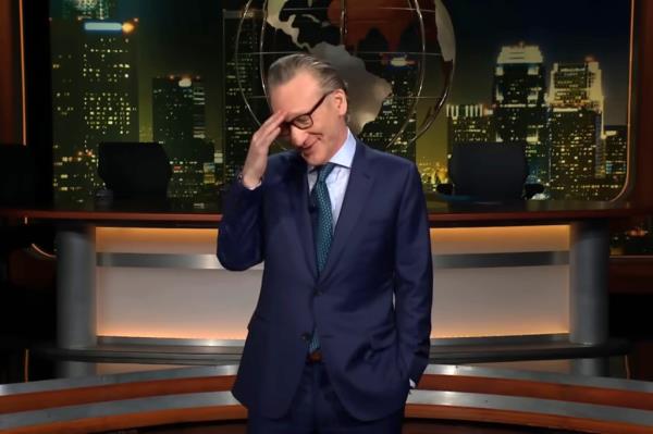 Bill Maher in a suit, hand on his head, expressing disappointment during a segment on Real Time with Bill Maher HBO.