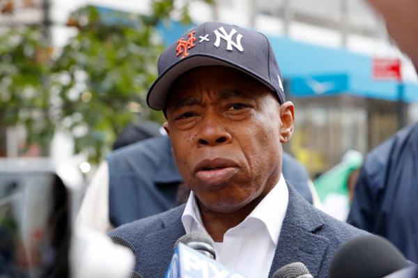 New York City Mayor Eric Adams speaking to the media before marching in the annual Columbus Day Parade on Fifth Avenue