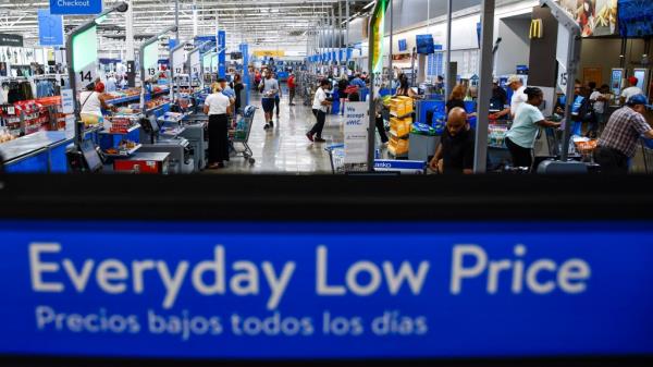 Customers using self-checkout at a Walmart Superstore in Secaucus, New Jersey on July 11, 2024 near an 