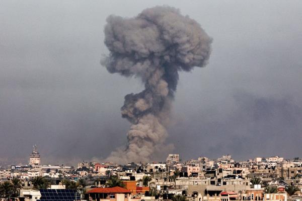 A plume of smoke hovers over Gaza's southern hub of Khan Yunis following an Israeli airstrike.