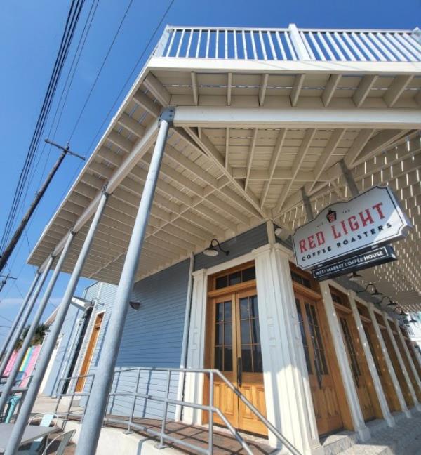 A few doors down from Maceo's, you can find Red Light Coffee Roasters, which boasts the 1900 storm survivor sign