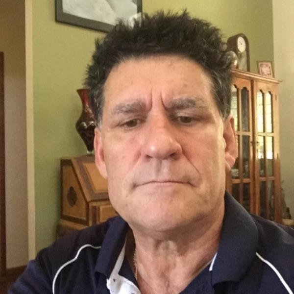 Cafe owner Adrian Dall'oste was praised for throwing out a family and their screaming toddler. 