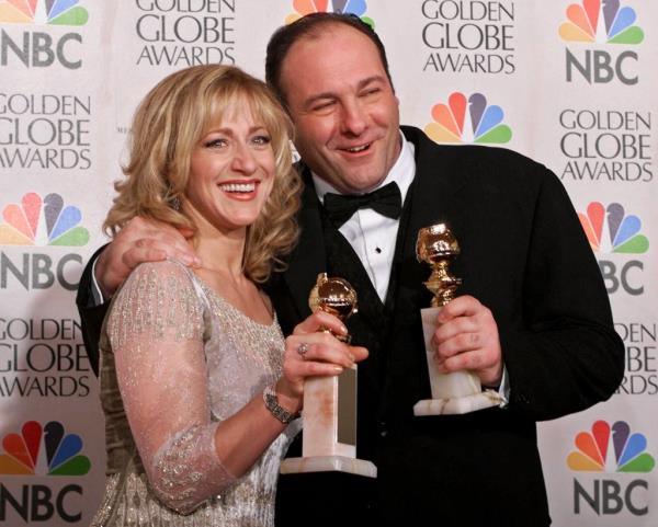 Edie Falco, left, and James Gandolfini hold their awards for best performance by an actress and actor in a dramatic televison series during the 57th Golden Globe Awards in 2000.