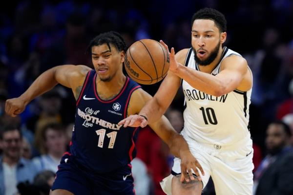 Ben Simmons (right) battles Jaden Springer for the ball during the Nets' 136-121 win over the 76ers.
