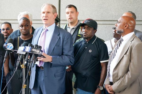 MTA CEO Janno Lieber, (right)  Anthony Nelson outside, upon leaving courtroom after final of two hearings at Bronx Criminal Courthouse this morning.