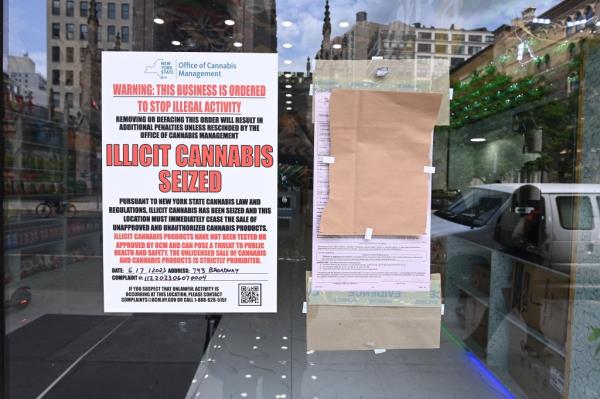 A notice posted outside of a illegal pot shop in Manhattan.