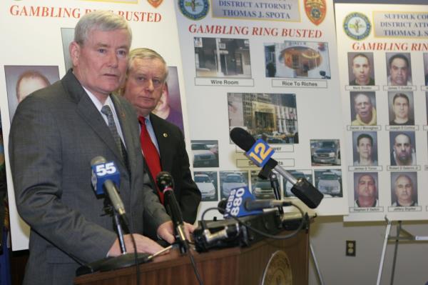 Suffolk Police Commissio<em></em>ner Richard Dormer and Suffolk DA, Thomas Spota speaking at a podium. 