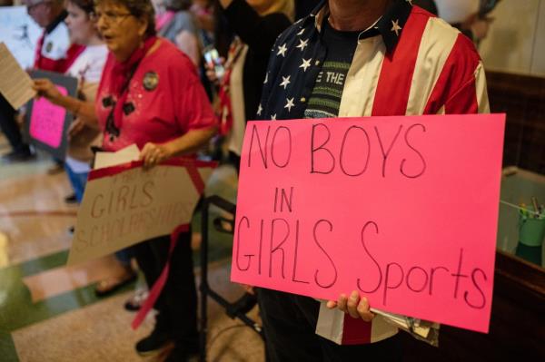 Demo<em></em>nstrators holding signs and gathering at Texas State Capitol in Austin for third special session of legislature on September 20, 2021.
