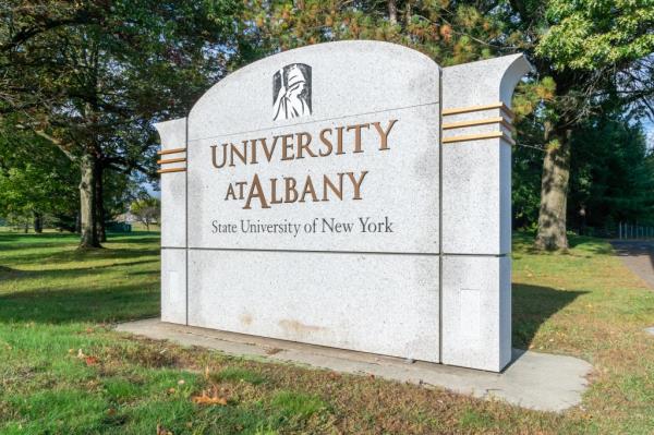 Entrance sign and logo on the campus of the University at Albany.