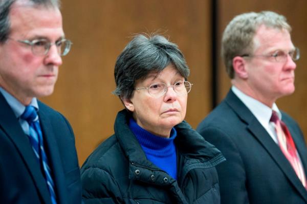 Linda Kosuda-Bigazzi, a 70-year-old woman in glasses and a blue sweater, appearing in Bristol Superior court accused of murdering her husband, Dr. Pierluigi Bigazzi.