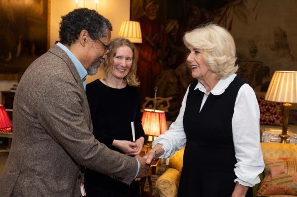 Queen Camilla (R) shakes hands with US writer Percival Everett during a reception for the Booker Prize Foundation at Clarence House, in London, on November 12, 2024 ahead of the Booker Prize 2024 ceremony.