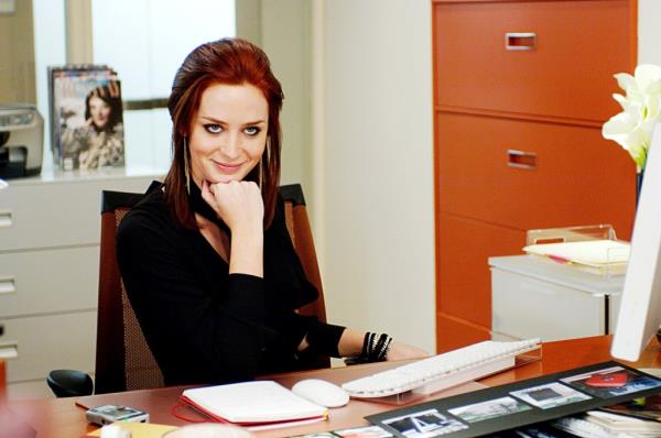 Emily Blunt smirking. 
