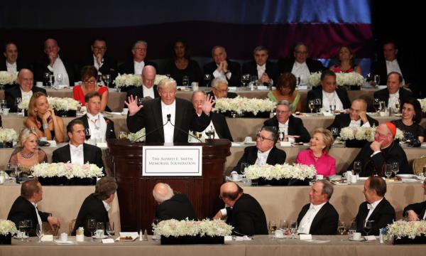 Do<em></em>nald Trump speaking at the podium during the 71st annual Alfred E. Smith Memorial Foundation Dinner surrounded by noted personalities