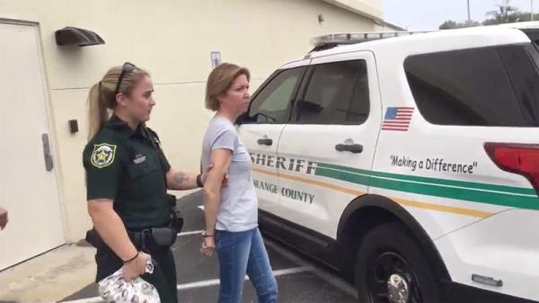 Boone being arrested.