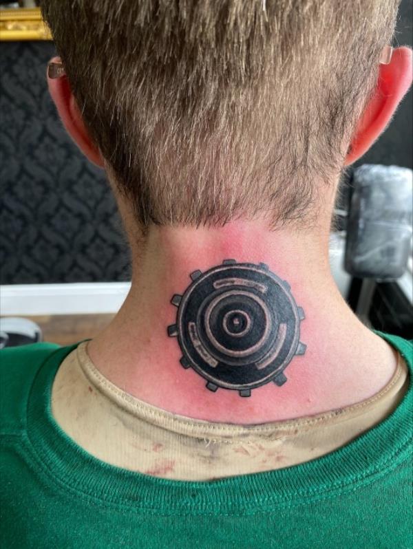William Cuthbert's headjack tattoo on the back of his neck, still red around the edges