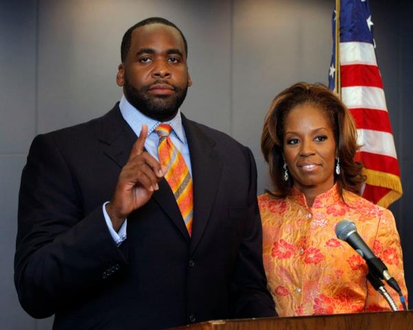 Detroit Mayor Kwame Kilpatrick standing with his wife Carlita in his office, after accepting a plea deal in text message scandal