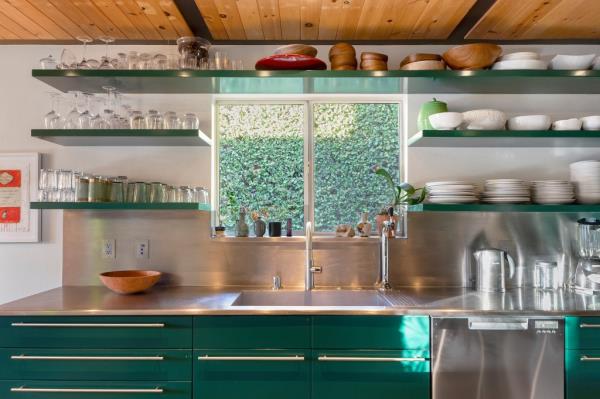 A view of the kitchen details with floating shelves. 