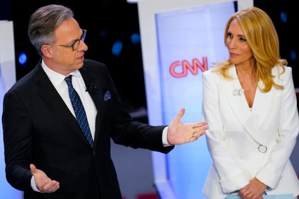 CNN anchors Jake Tapper, left, and Dana Bash, right, speaking to members of the audience before the start of the CNN Republican presidential debate in Des Moines, Iowa, Jan. 10, 2024.
