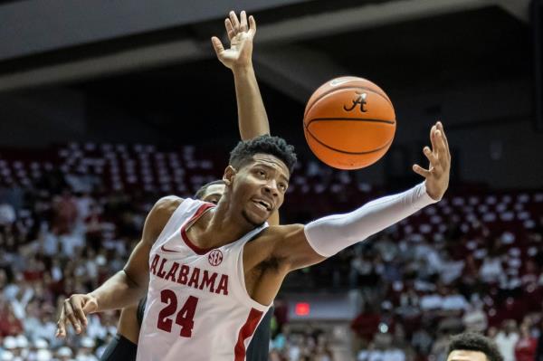 Alabama forward Brandon Miller (24) reaches for a rebound against Vanderbilt during the first half of an NCAA college basketball game, Tuesday, Jan. 31, 2023