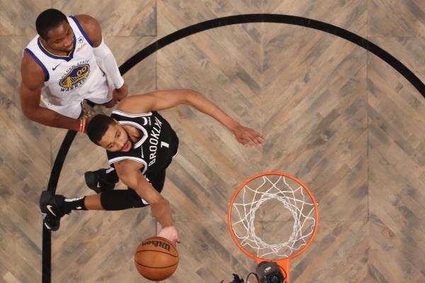 The Nets' Mikal Bridges skies to the basket during Monday's game against the Warriors.