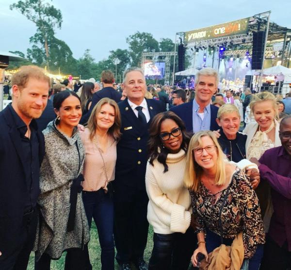 Prince Harry, Meghan Markle, Oprah Winfrey, Ellen DeGeneres, and Portia de Rossi posing together with Santa Barbara City Fire Department's Fire Chief, Chris Mailes, at the One805 charity event.