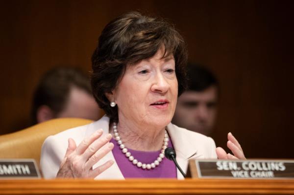 Senator Susan Collins, R-Maine, speaking into a microphone on Capitol Hill in Washington.