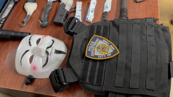 A mask and NYPD vest co<em></em>nfiscated from the suspect.
