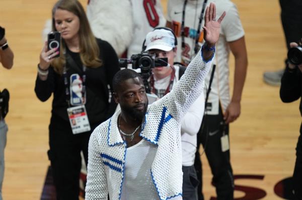 Former Miami Heat player Dwayne Wade reacts to the crowd during the first quarter in game three of the 2023 NBA Finals at Kaseya Center.