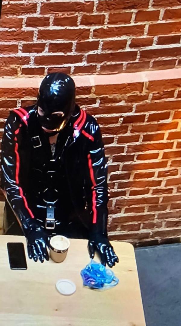 A man dressed as a gimp.