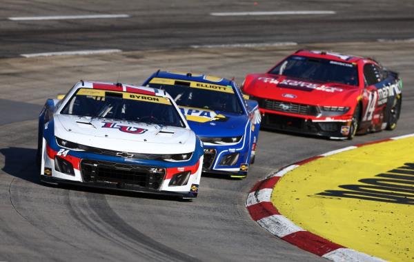 William Byron, driver of the #24 Liberty University Chevrolet,  Chase Elliott, driver of the #9 NAPA Auto Parts Chevrolet, and Chase Briscoe, driver of the #14 Mahindra Tractors Ford, race during the NASCAR Cup Series Xfinity 500 at Martinsville Speedway on November 03, 2024 in Martinsville, Virginia. 