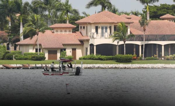 A San Carlos Park Fire Rescue boat remains on the lake as the search for a missing Florida Gulf Coast University student co<em></em>ntinues in Fort Myers .