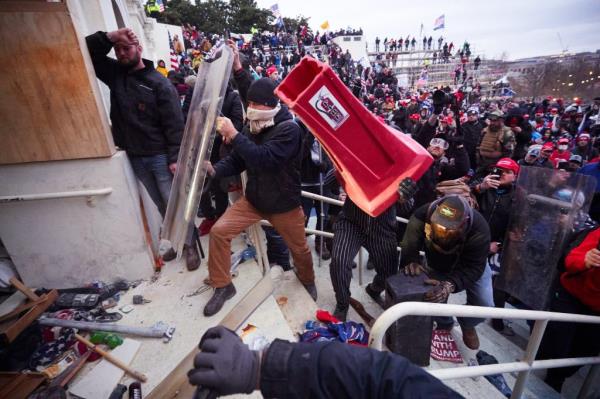 Supporters of President Do<em></em>nald Trump clash with police at the US Capitol on Wednesday, January 6, 2021 in Washington, D.C