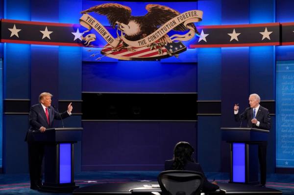 President Do<em></em>nald Trump, left, and Democratic presidential candidate former Vice President Joe Biden speak during the debate in Nashville, Tenn. on Oct. 22, 2020. 