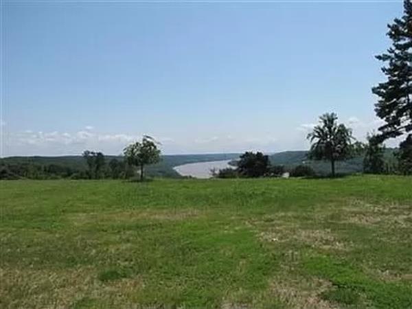 The sprawling property boasts river front views.