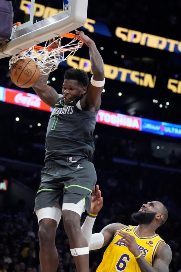 Anthony Edwards dunks over LeBron James on April 11, 2023.