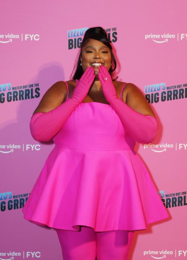 Lizzo in hot pink on red carpet