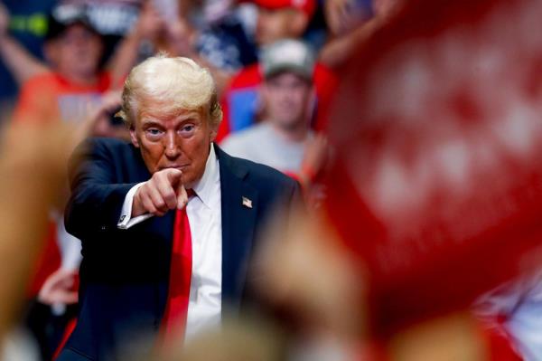 Former Republican President Do<em></em>nald Trump pointing his finger while campaigning with his running mate, Ohio Sen. J.D. Vance, at Van Andel Arena in Grand Rapids.