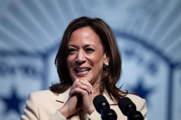 US Vice President Kamala Harris delivering a keynote speech at Zeta Phi Beta Sorority event in Indiana, smiling at the camera