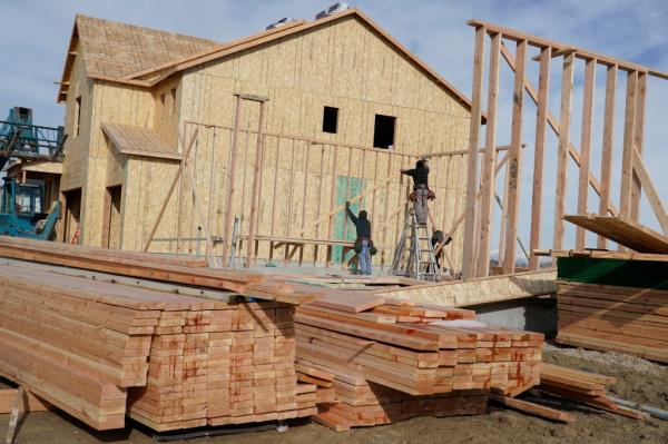 Piles of lumber on the co<em></em>nstruction site of a single family home in Lehi, Utah