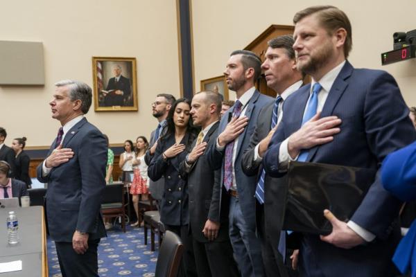 FBI Director Christopher Wray pledges allegiance prior to testifying before the House Judiciary Committee on Capitol Hill in Washington, DC on Wednesday, July 24, 2024.
