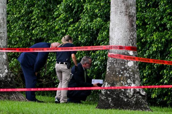 Law enforcement officials work at the crime scene outside the Trump Internatio<em></em>nal Golf Club in West Palm Beach, Florida, on September 16, 2024