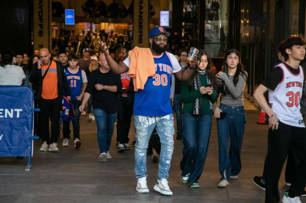 Knicks fans react to the Knicks losing to the Indiana Pacers in the eastern co<em></em>nference semi-finals playoffs in front of Madison Square Garden.